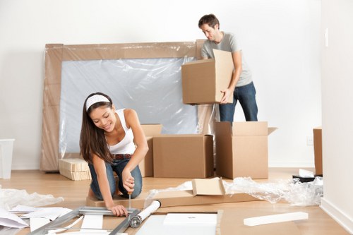 Professional house removals planning in Stgiles with packed boxes and moving equipment