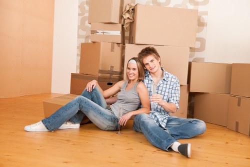 House removals team loading furniture for transport in St Giles