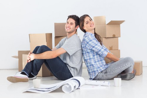 Professional flat removals in Stgiles with movers loading boxes into a van