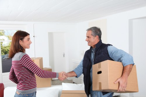 Organised storage unit in Stgiles with labelled boxes and furniture